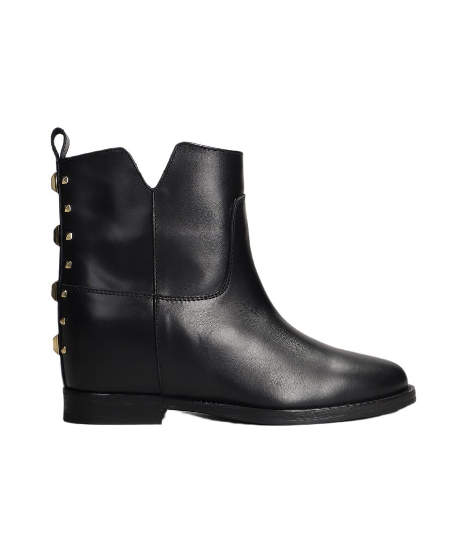 Black leather boots with silver studs top