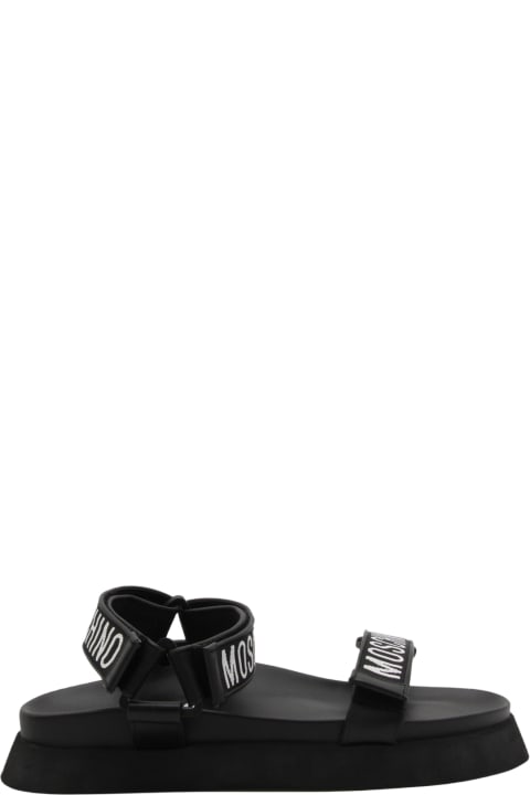 メンズ Moschinoのその他各種シューズ Moschino Black Rubber Logo Sandals