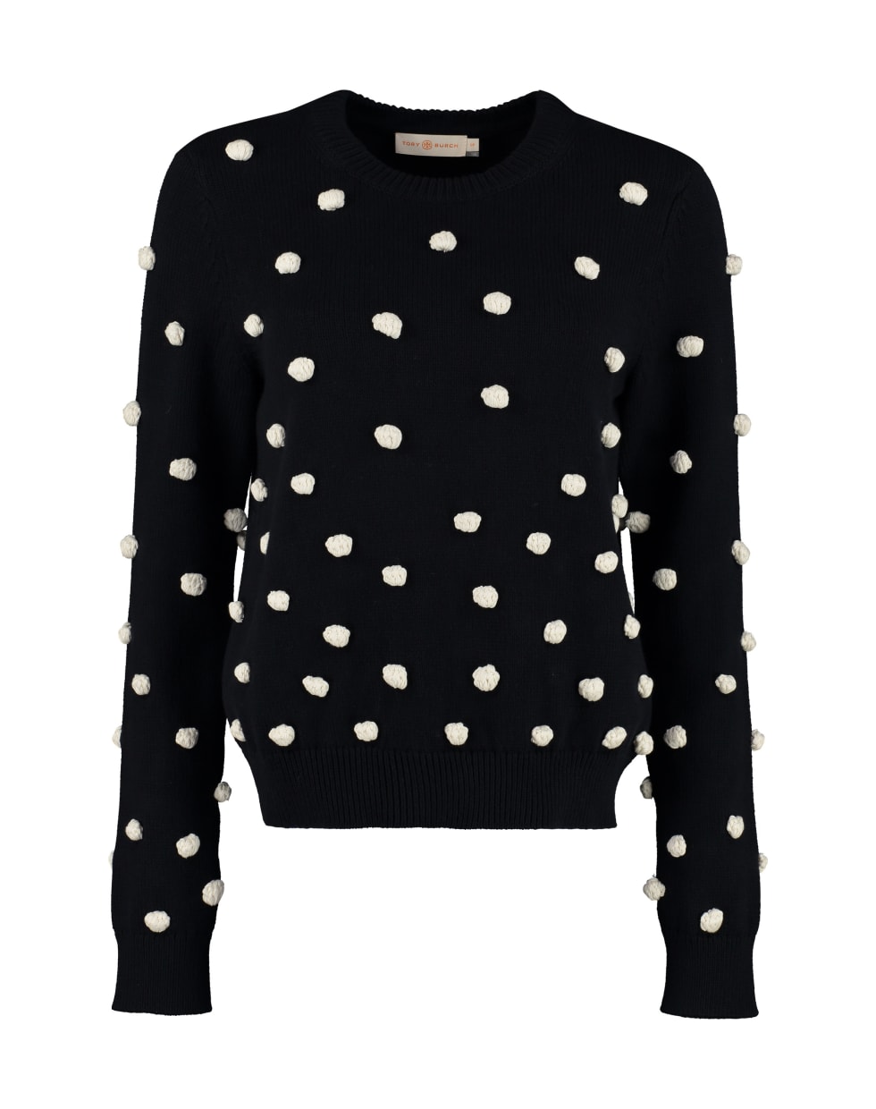 white sweater with pom poms