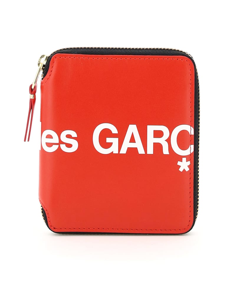 comme des garcons zip around wallet que significa