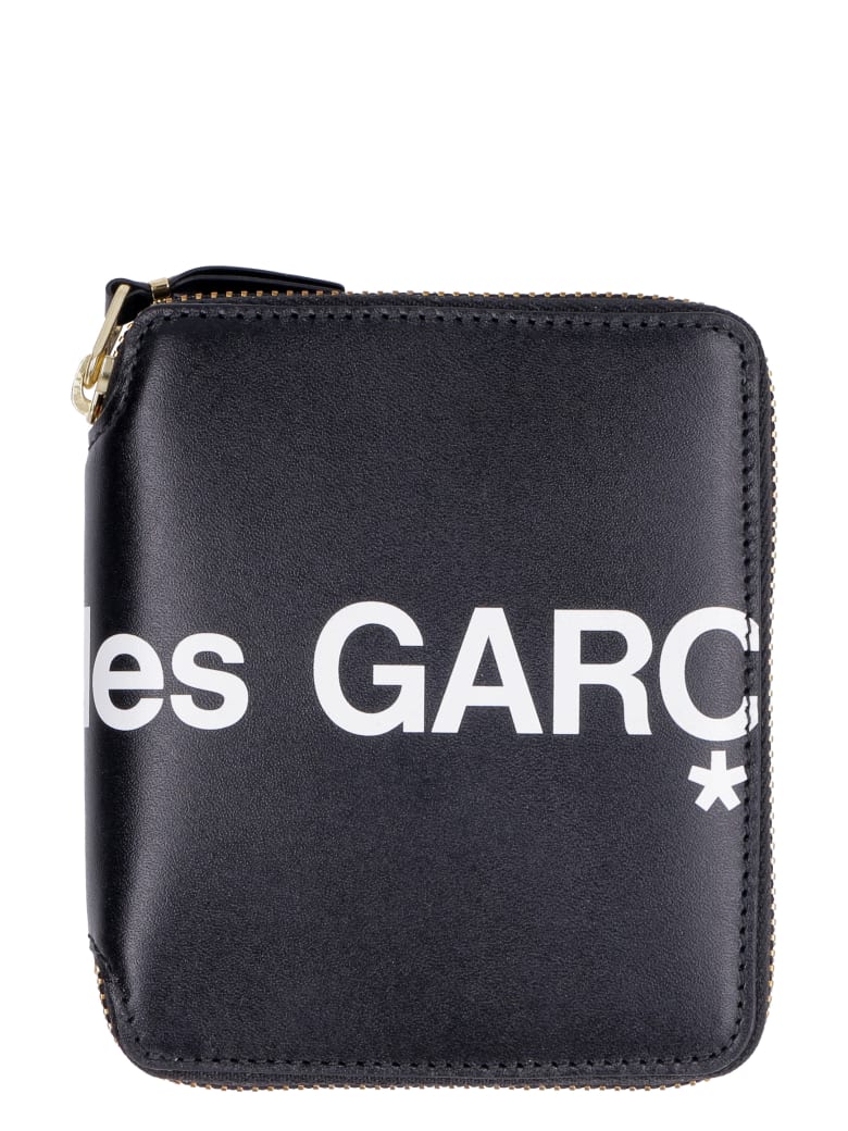 comme des garcons zip around wallet que significa