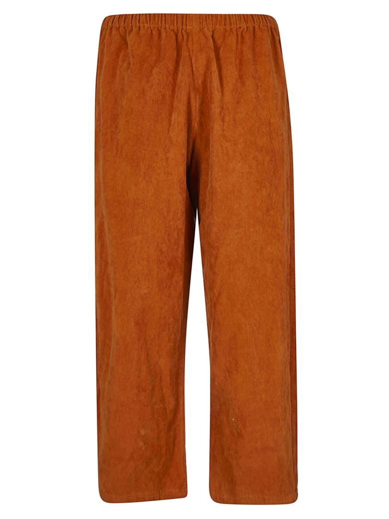 orange cropped trousers