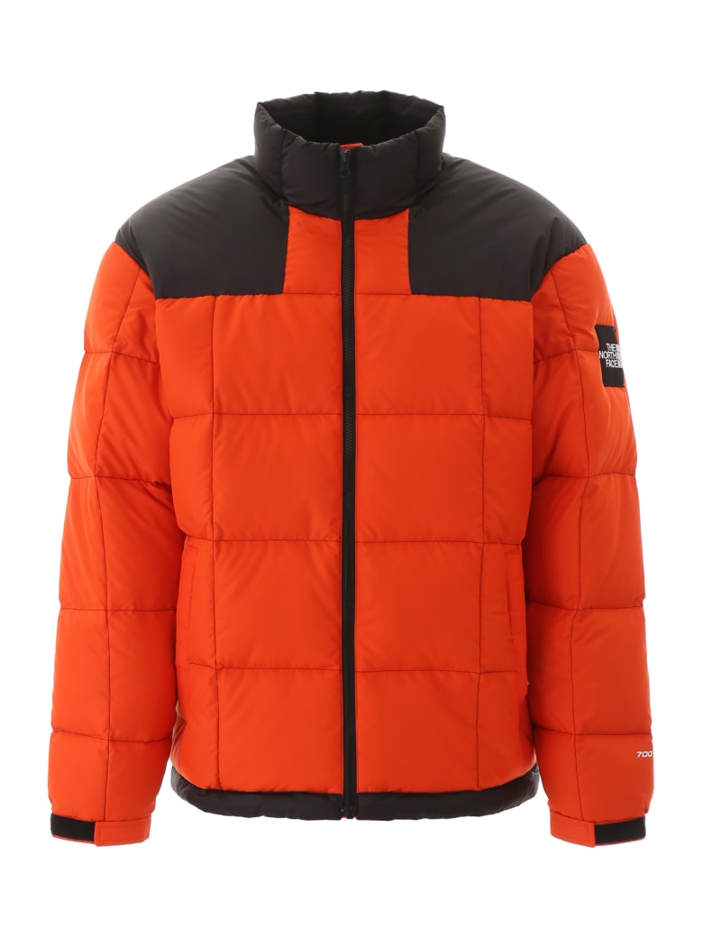 orange and black north face jacket