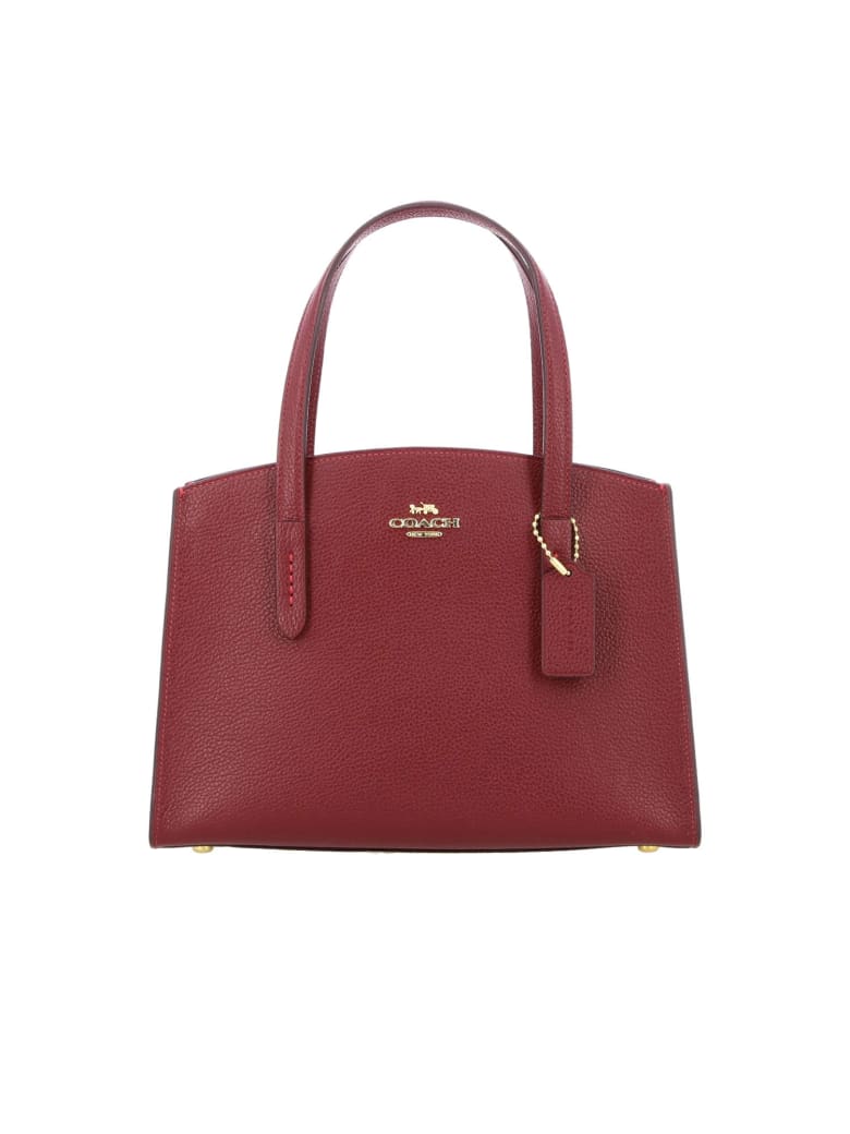 burgundy coach purse