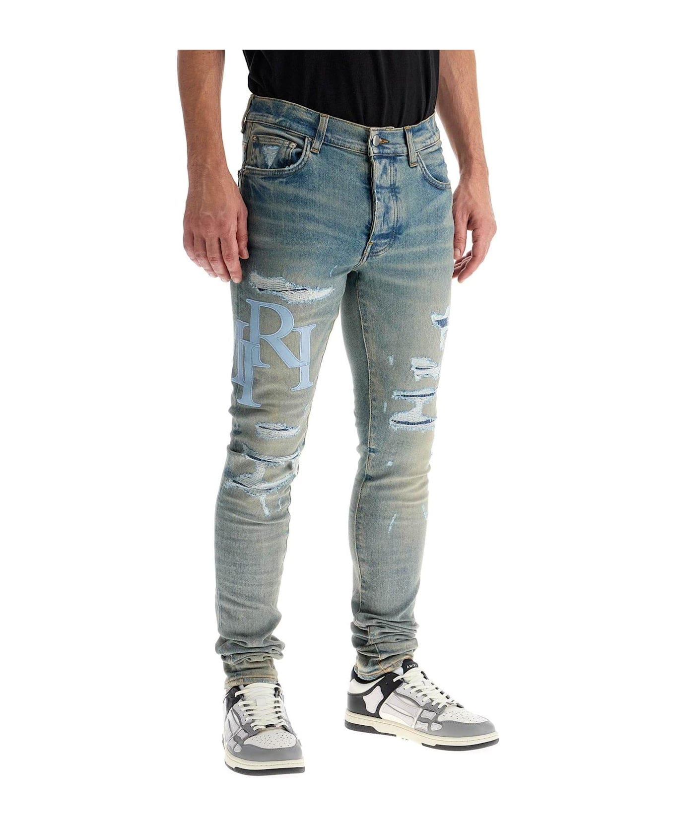 AMIRI Logo Patch Distressed Skinny Jeans - BLUE