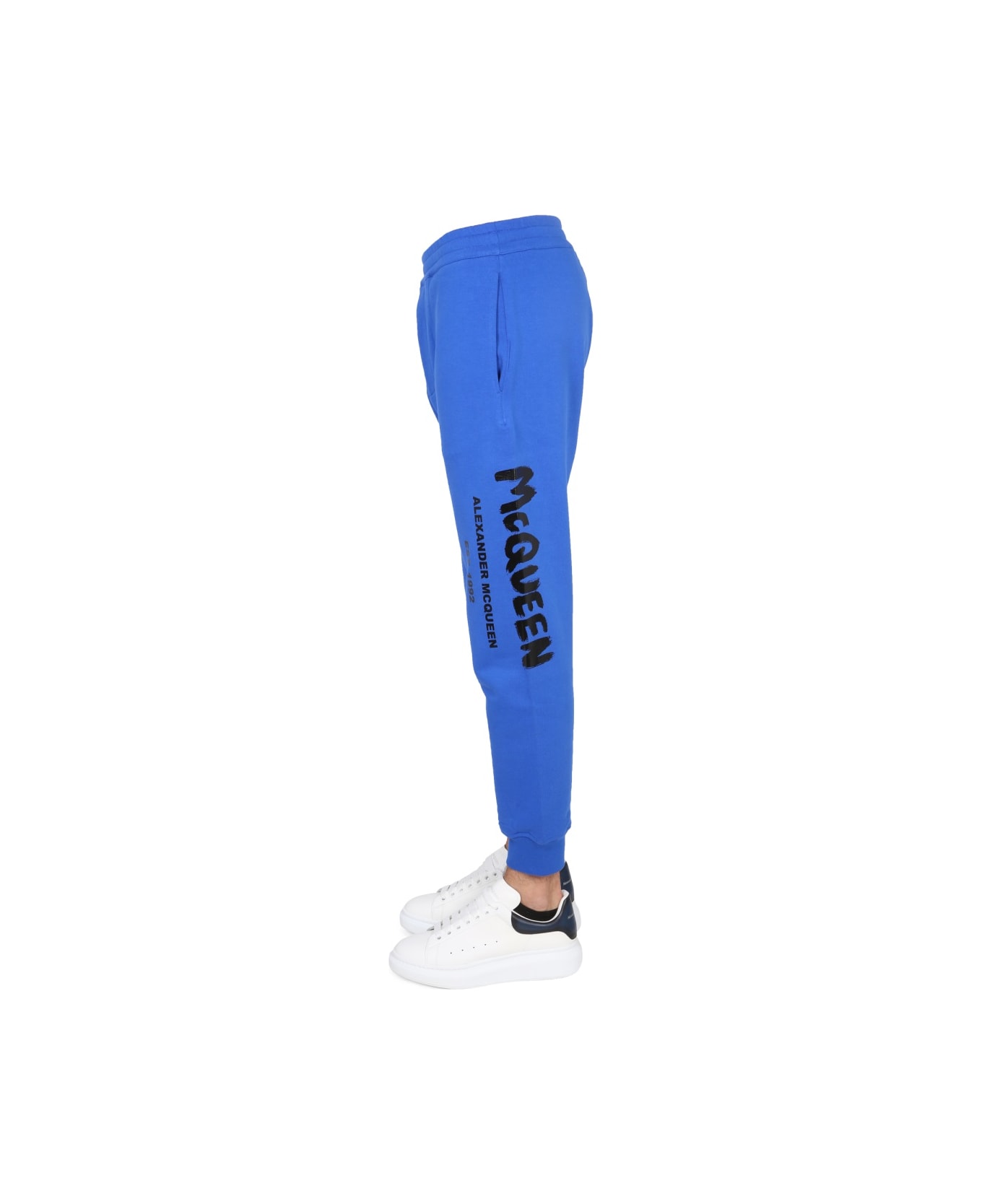 Alexander McQueen Jogging Pants With Graffiti Logo - BLUE