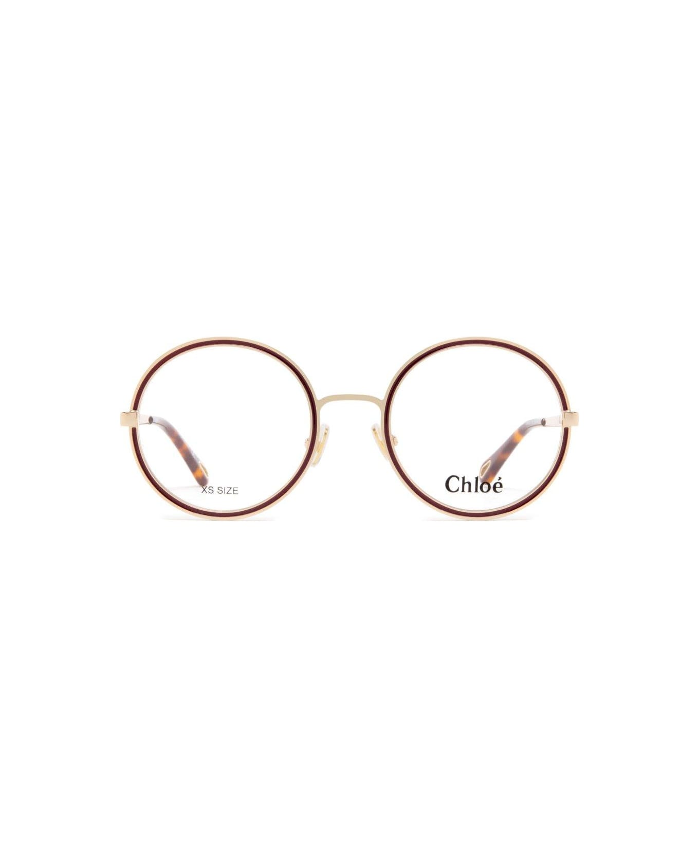 Chloé Eyewear Round Frame Glasses - 001 gold gold transparent