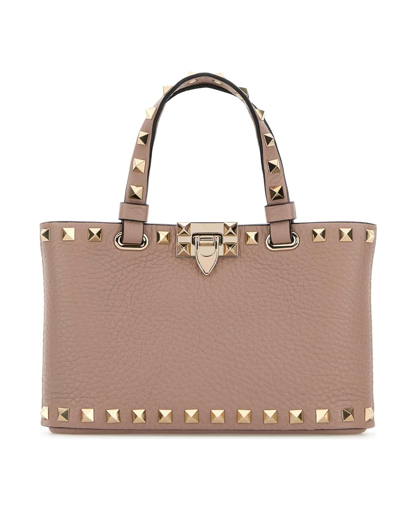 Valentino Garavani Antiqued Pink Leather Rockstud Handbag - POUDRE