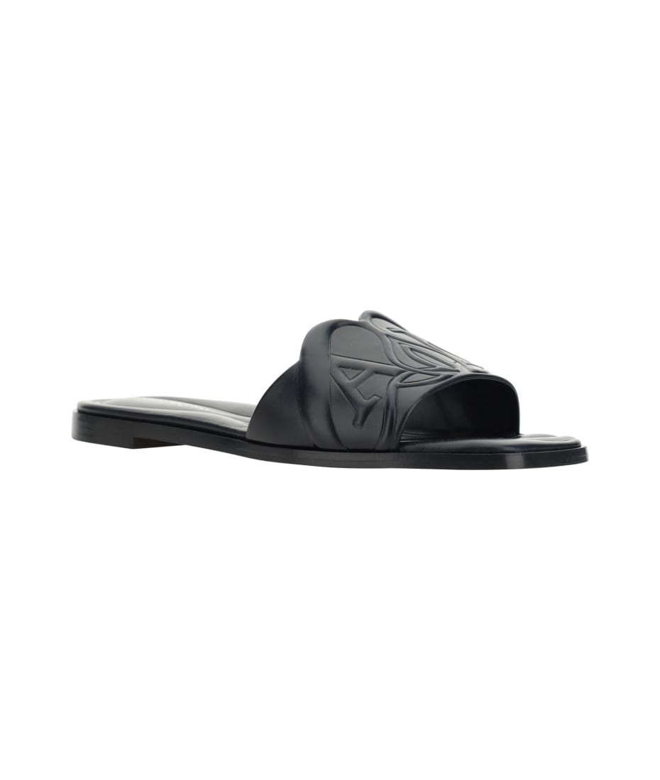 Alexander McQueen The Seal Embossed Slip-on Slides | italist