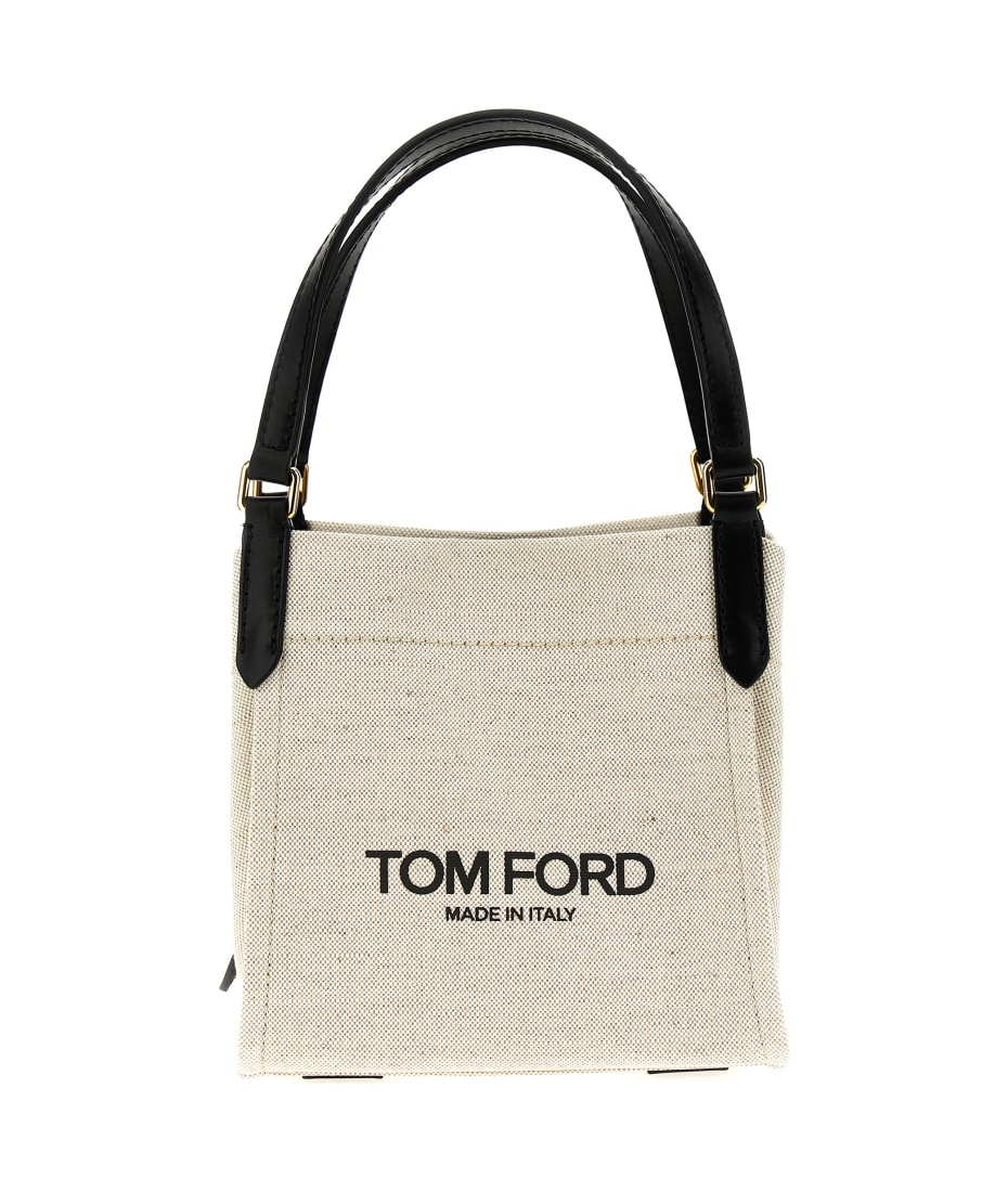TOM FORD logo-patch raffia shoulder bag - Neutrals | £805.00 | Grazia