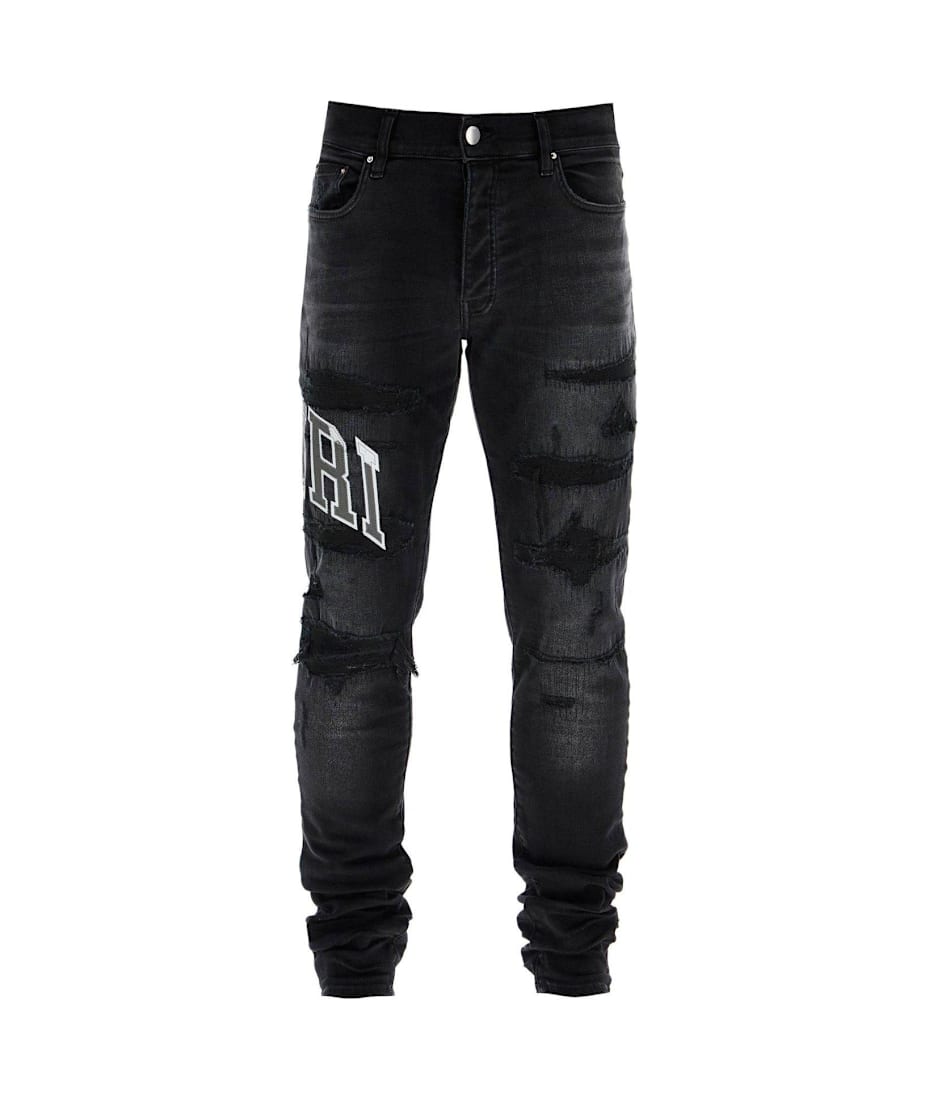 AMIRI Logo Patch Distressed Skinny Jeans italist