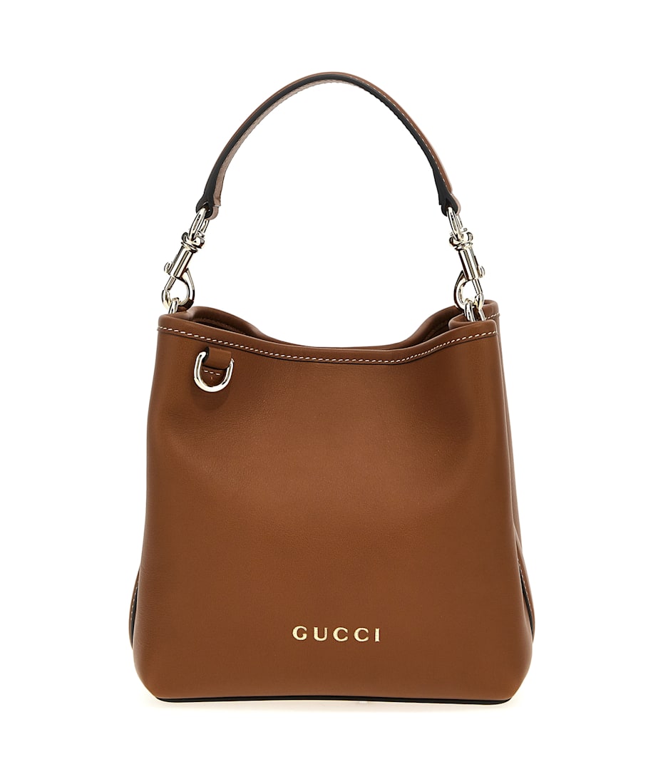 【GUCCI】GG EMBLEM SMALL BUCKET BAG GG Emblem small bucket bag in beige and dark brown fabric