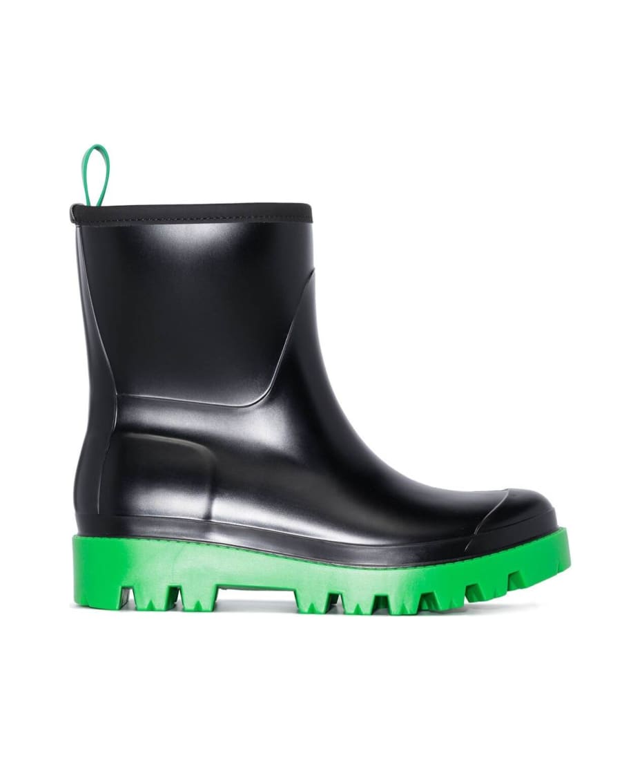 black boots with green bottom