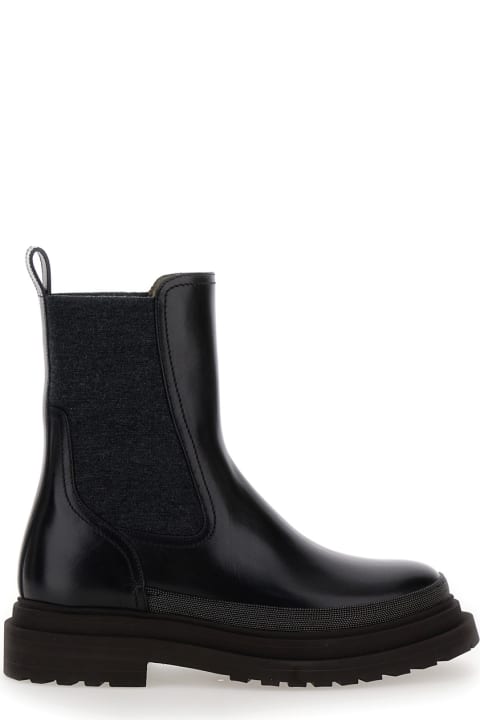 ウィメンズ Brunello Cucinelliのブーツ Brunello Cucinelli Black Slip-on Boots With Lug Sole And Monile In Leather Woman