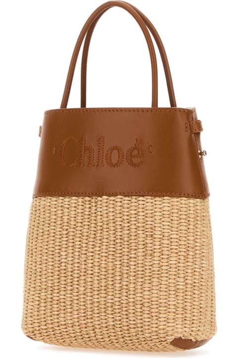 ウィメンズ Chloéのトートバッグ Chloé Bicolor Raffia And Leather Micro Handbag