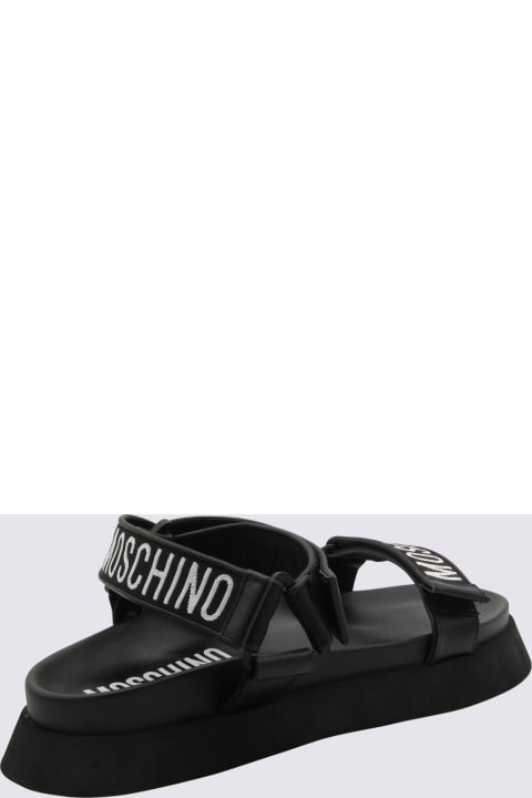 メンズ Moschinoのその他各種シューズ Moschino Black Rubber Logo Sandals
