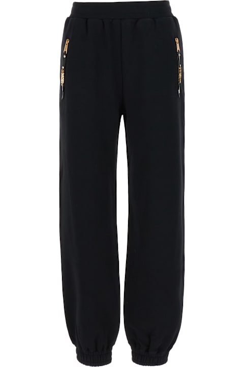 Fleeces & Tracksuits for Women Moschino Black Cotton Joggers