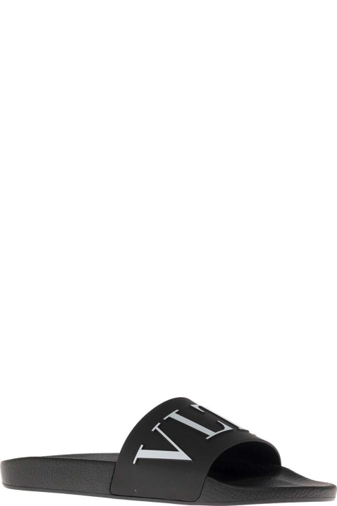 Valentino Garavani Man's Black Rubber Slide Sandals With Logo