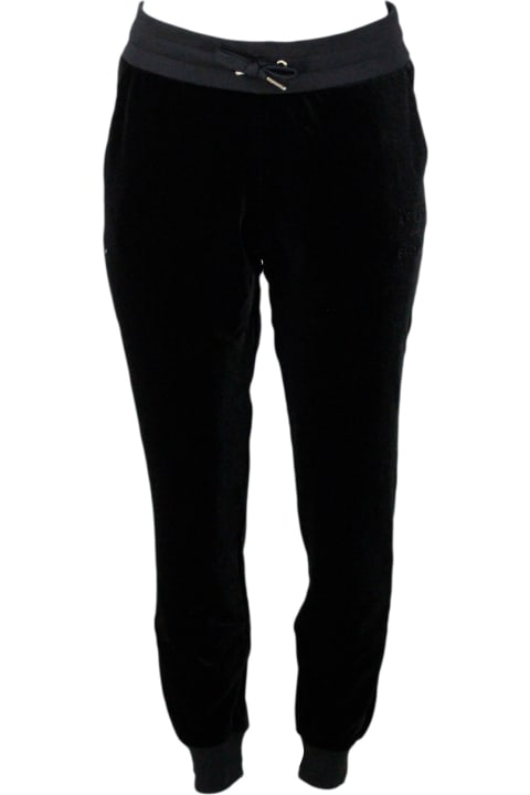 Stretch Jogging Trousers With Drawstring And Elastic Waistband Made Of Soft Chenille. Logo On The Leg