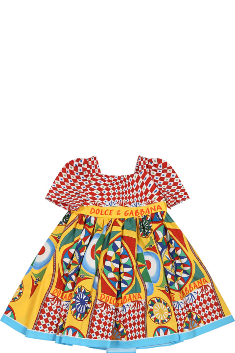 Dolce & Gabbanaのベビーガールズ Dolce & Gabbana Red Dress For Baby Girl With Logo And Cart Print