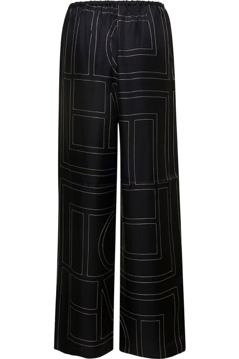 Black Loose Pants With Monogram Print In Silk Woman