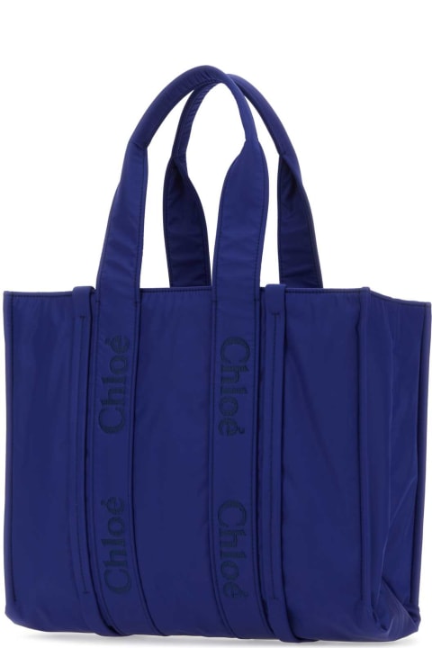 Chloé Totes for Women Chloé Blue Fabric Large Woody Shopping Bag