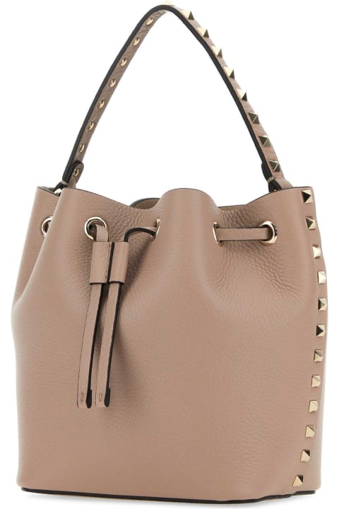 Valentino Garavani Bags for Women Valentino Garavani Antiqued Pink Leather Rockstud Bucket Bag