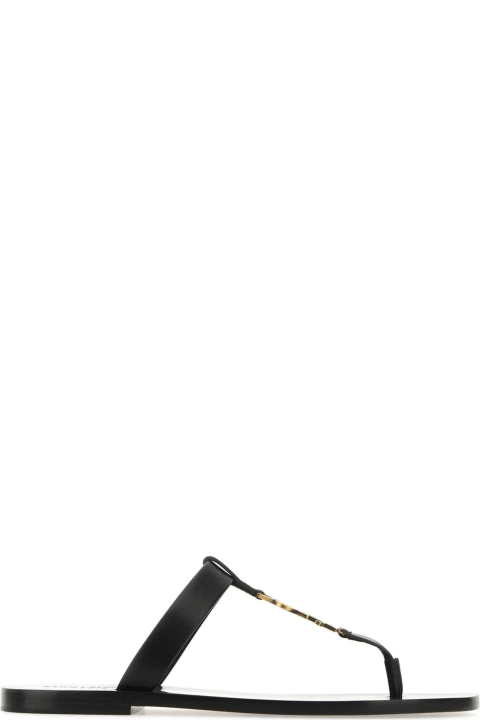 Saint Laurent Shoes for Men Saint Laurent Black Leather Cassandre Thong Slippers