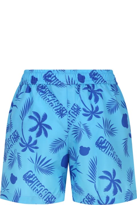 Swimwear for Boys Moschino Light Blue Swim Shorts For Boy With Tropical Pattern And All-over Logo