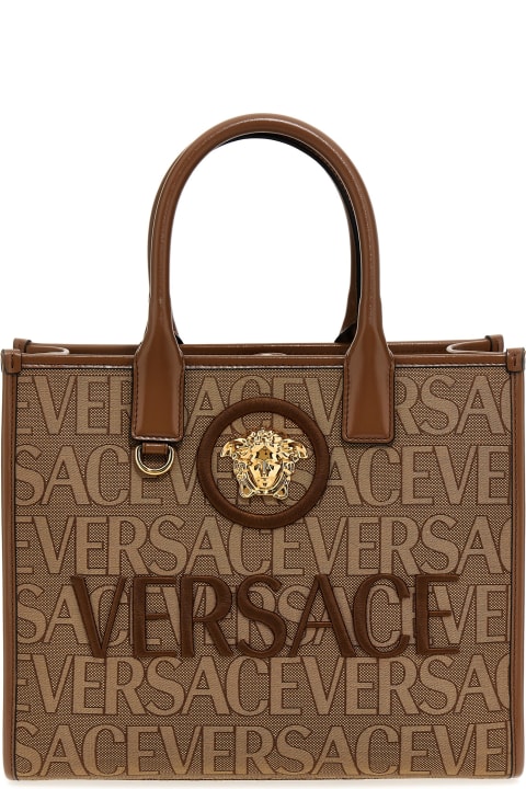 All over logo large tote bag by Versace La Vacanza