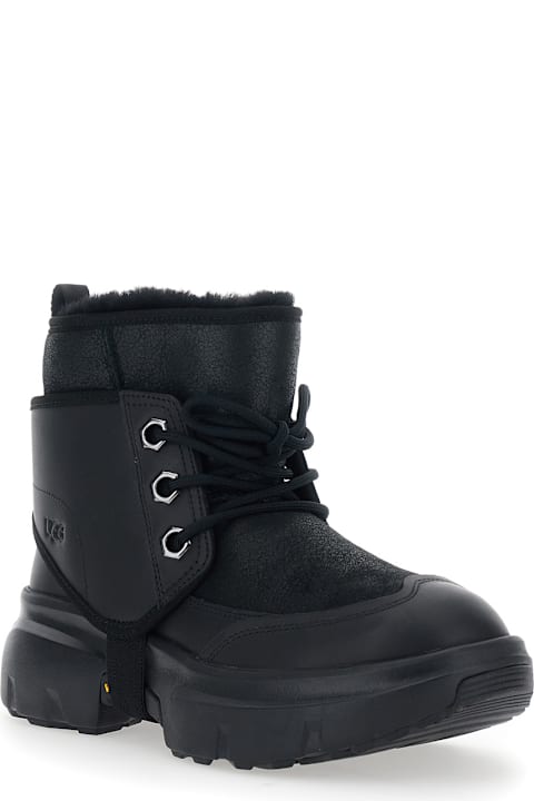 UGG for Kids UGG Black Ankle Boots With Side Logo And Platform Sole In Leather Blend Woman