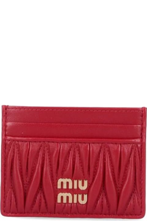 Pink GG-embossed matelassé-leather wallet bag, Gucci