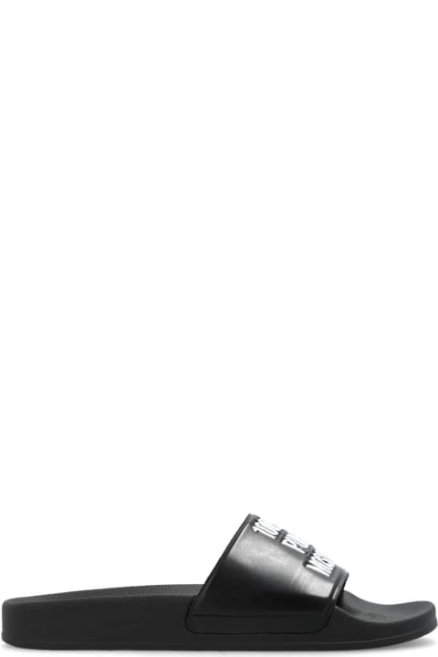 ウィメンズ Moschinoのサンダル Moschino Logo-embossed Slides