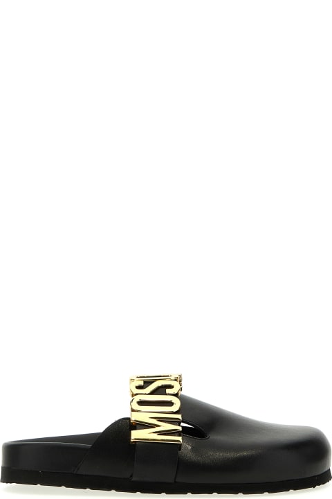 ウィメンズ Moschinoのフラットシューズ Moschino Logo Mules
