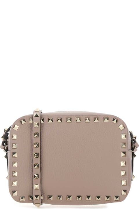 Valentino Garavani for Women Valentino Garavani Antiqued Pink Leather Rockstud Crossbody Bag