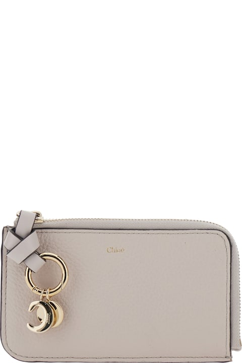 Chloé إكسسوارات لـ السيدات Chloé Grey Wallet With Logo Charm On The Front And Top Zip Closure In Grained Leather Woman
