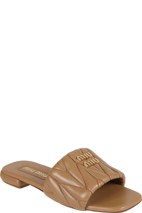 Flat Shoes for Women Miu Miu Logo Quilted Sliders