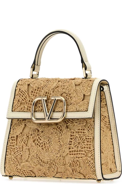 Bags for Women Valentino Garavani Biege Raffia Vsling Handbag
