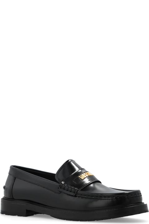 ウィメンズ Moschinoのフラットシューズ Moschino Logo Plaque Slip-on Loafers