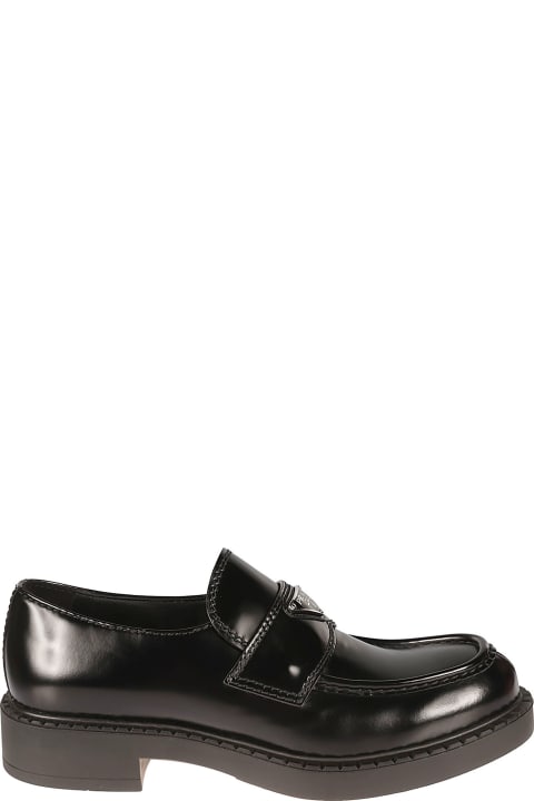 Prada Loafers & Boat Shoes for Men Prada Metal Logo Plaque Applique Loafers