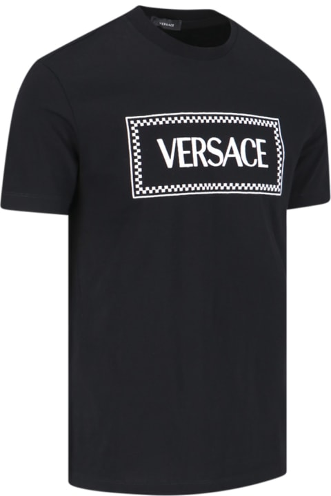 メンズ Versaceのトップス Versace Black Crewneck T-shirt With Contrasting Logo Lettering Print In Cotton Man