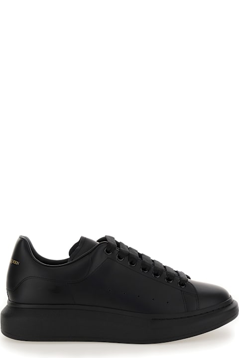 Alexander McQueen Sneakers for Men Alexander McQueen Black Sneakers With Logo Lettering On The Rear And Oversize Rubber Sole In Leather Man
