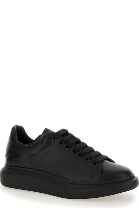 Alexander McQueen Sneakers for Men Alexander McQueen Black Sneakers With Logo Lettering On The Rear And Oversize Rubber Sole In Leather Man