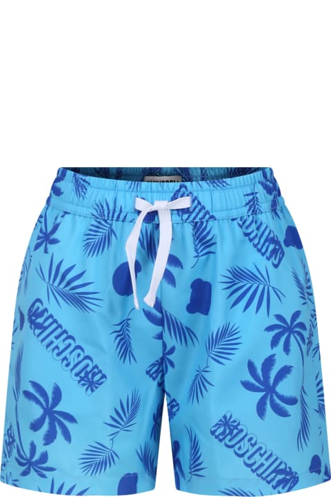 Swimwear for Boys Moschino Light Blue Swim Shorts For Boy With Tropical Pattern And All-over Logo