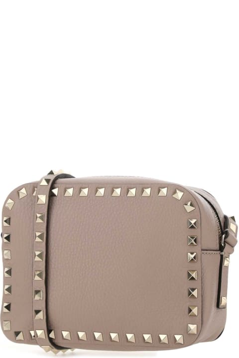 ウィメンズ Valentino Garavaniのショルダーバッグ Valentino Garavani Antiqued Pink Leather Rockstud Crossbody Bag