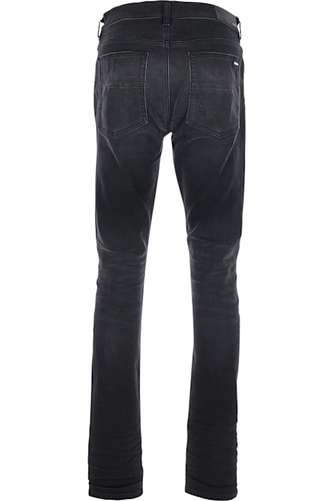 AMIRI for Men AMIRI Black Jeans With Ripped Details On The Front And Logo Patch On The Rear In Denim Man