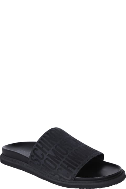 Moschino Other Shoes for Men Moschino Black Logo Allover Slides Sandals
