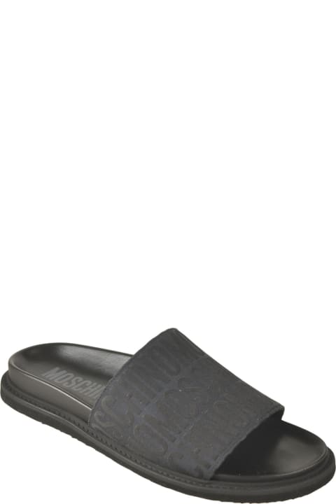 Moschino Other Shoes for Men Moschino All-over Logo Sliders