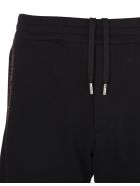 Man Black Slim Fit Joggers With Contrast Logoed Selvedge Tapes Alexander McQueen Man Black Slim Fit Joggers With Contrast Logoed Selvedge Tapes - Black