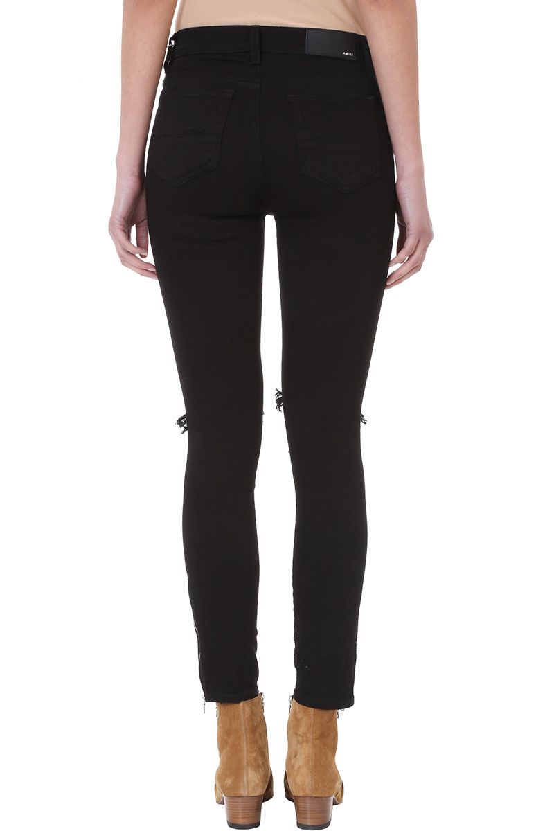 black amiri jeans with patches